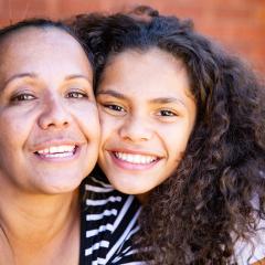 Woman and girl smiling