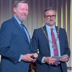 Professor Anthony Smith (left) receiving his honorary doctorate award from SDU Rector Jens Ringsmose (right) in Odense, Denmark